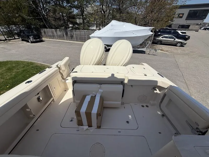 Slide: The Image of 2025 Grady-White Freedom 285 boat interior, featuring spacious deck and seating area. - 3