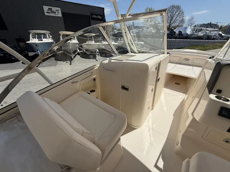 Slide: The Image of 2025 Grady-White Freedom 285 boat interior with seating and helm station. - 6