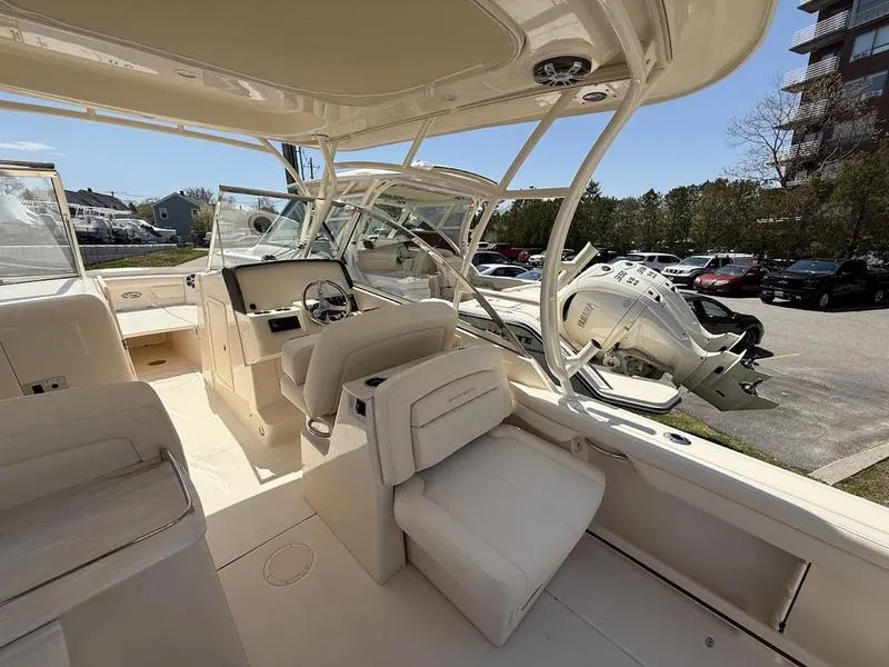 Slide: The Image of 2025 Grady-White Freedom 285 boat interior with helm and seating area. - 9