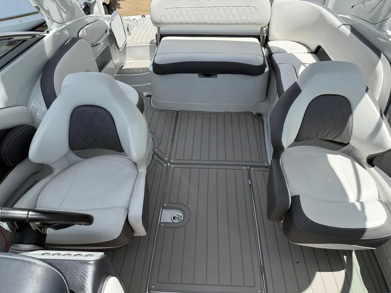 Slide: The Image of 2023 Crownline 250 XSS boat interior with modern seating and sleek design. - 7