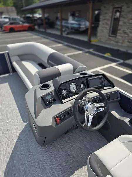 Slide: The Image of 2025 Bennington 20 SL boat interior with modern dashboard and steering wheel. - 6