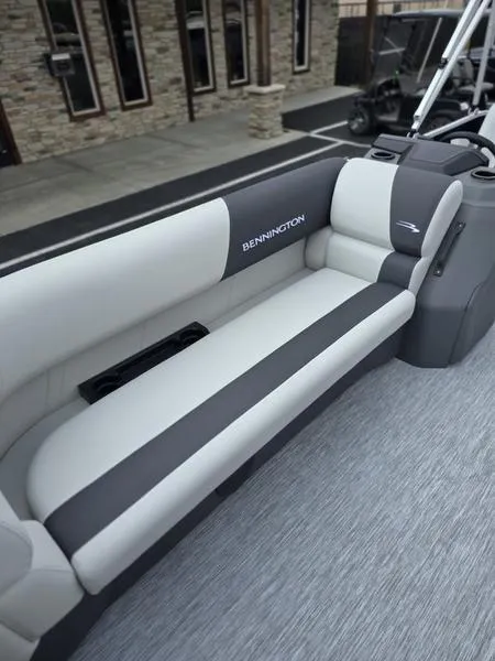 Slide: The Image of 2025 Bennington 20 SL boat interior with sleek gray and white seating. - 7