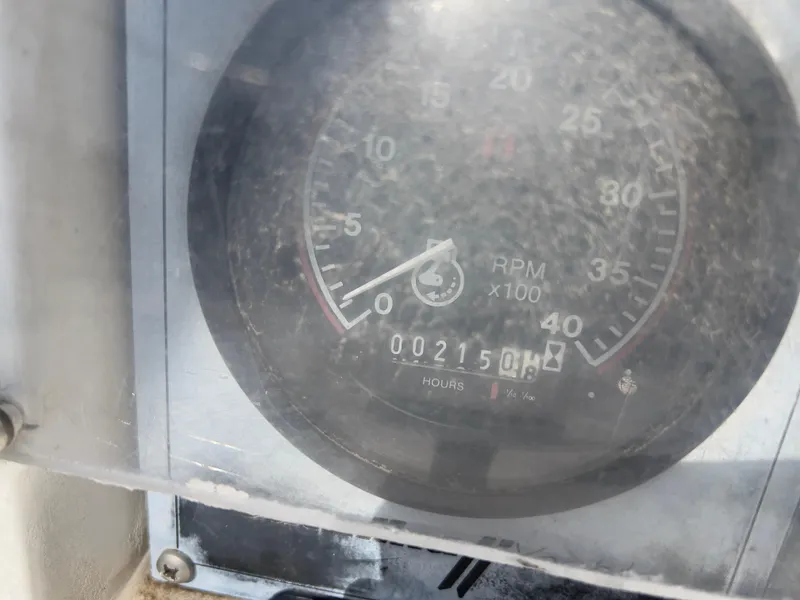 Slide: The Image of Close-up of a Catalina 30 tachometer showing 2150 hours, model year 1986. - 12