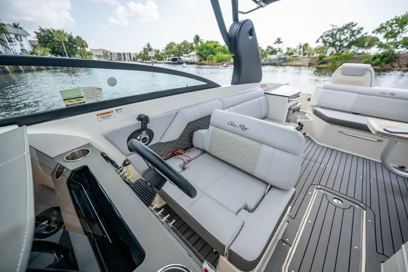 Slide: The Image of 2022 Sea Ray SDX 290 boat interior with luxurious seating and modern design. - 11