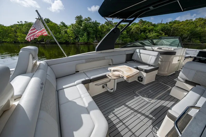 Slide: The Image of Luxurious 2022 Sea Ray SDX 290 boat interior with plush seating and elegant design. - 17
