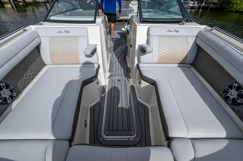 Slide: The Image of 2022 Sea Ray SDX 290 boat interior with spacious seating and modern design. - 28