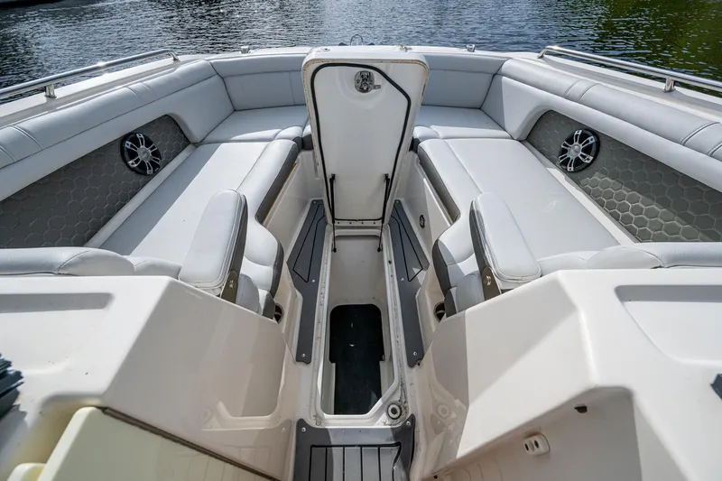 Slide: The Image of 2022 Sea Ray SDX 290 boat interior with spacious seating and storage compartments. - 32
