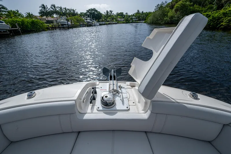 Slide: The Image of 2022 Sea Ray SDX 290 boat with open anchor hatch on a calm river. - 33