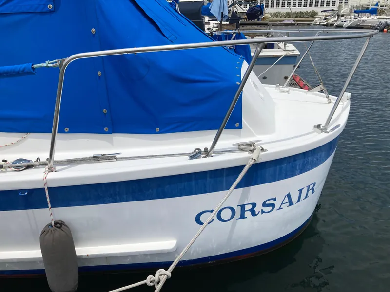 Slide: The Image of 1963 Sumnercraft 31 Motor Sailer named Corsair docked with blue cover. - 10