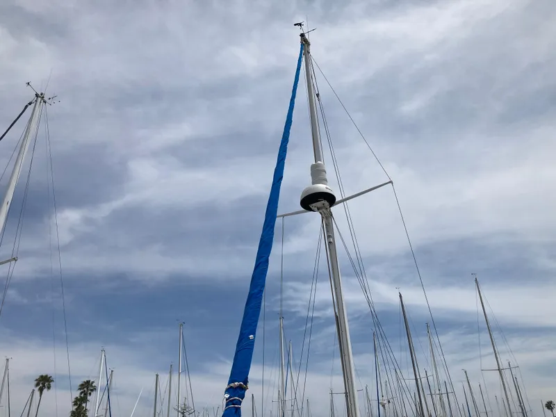 Slide: The Image of Mast of 1963 Sumnercraft 31 Motor Sailer against cloudy sky in marina. - 14