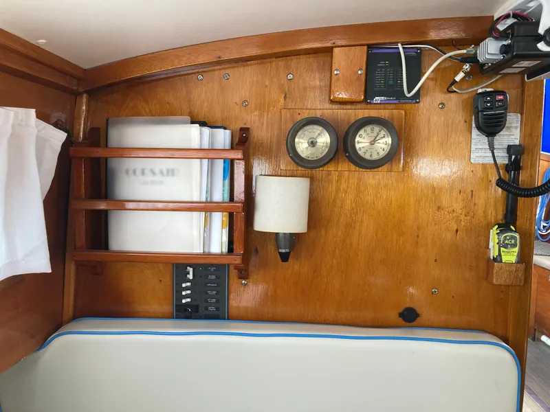 Slide: The Image of Interior of a 1963 Sumnercraft 31 Motor Sailer with wooden paneling and nautical instruments. - 20