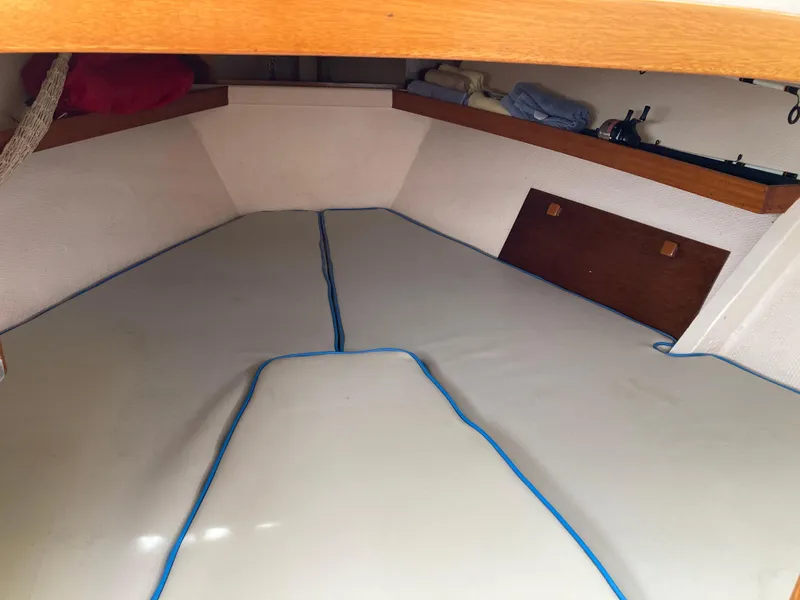 Slide: The Image of Interior cabin of 1963 Sumnercraft 31 Motor Sailer with cushioned seating and wooden accents. - 22