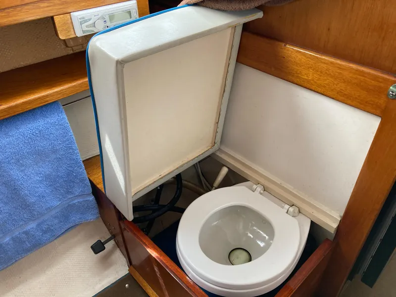 Slide: The Image of Toilet area in 1963 Sumnercraft 31 Motor Sailer with wooden cabinetry. - 24