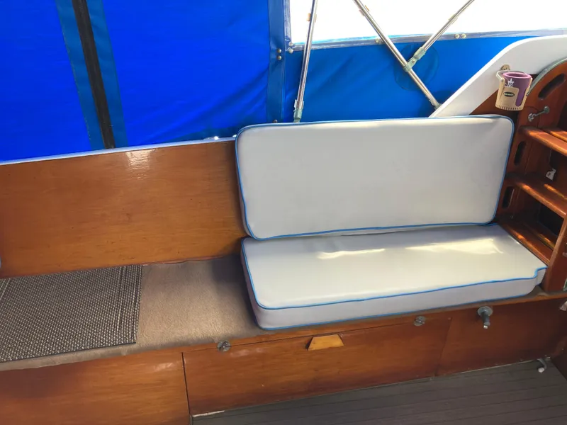 Slide: The Image of Interior of 1963 Sumnercraft 31 Motor Sailer with blue and white cushioned seating. - 27