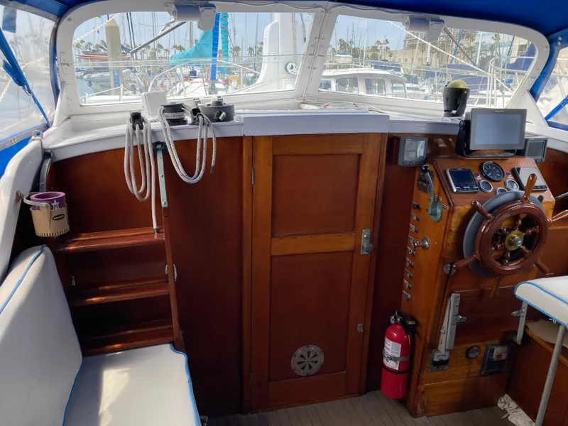 Slide: The Image of Cockpit of 1963 Sumnercraft 31 Motor Sailer with wooden helm and navigation equipment. - 28