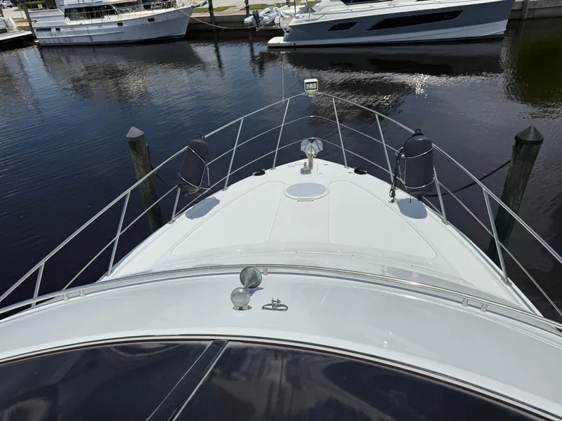 Slide: The Image of 2001 Carver 396 Motor Yacht docked at marina, view from bow. - 10
