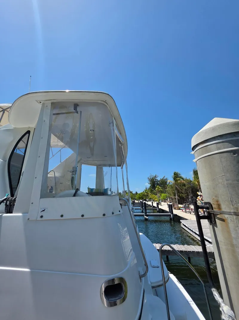 Slide: The Image of 2000 Carver 396 Motor Yacht docked under clear blue sky. - 13