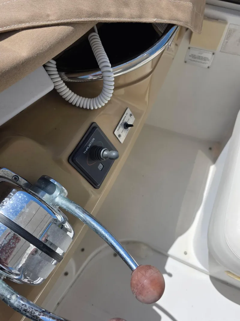 Slide: The Image of Control panel of a 2000 Carver 396 Motor Yacht with throttle and joystick. - 17