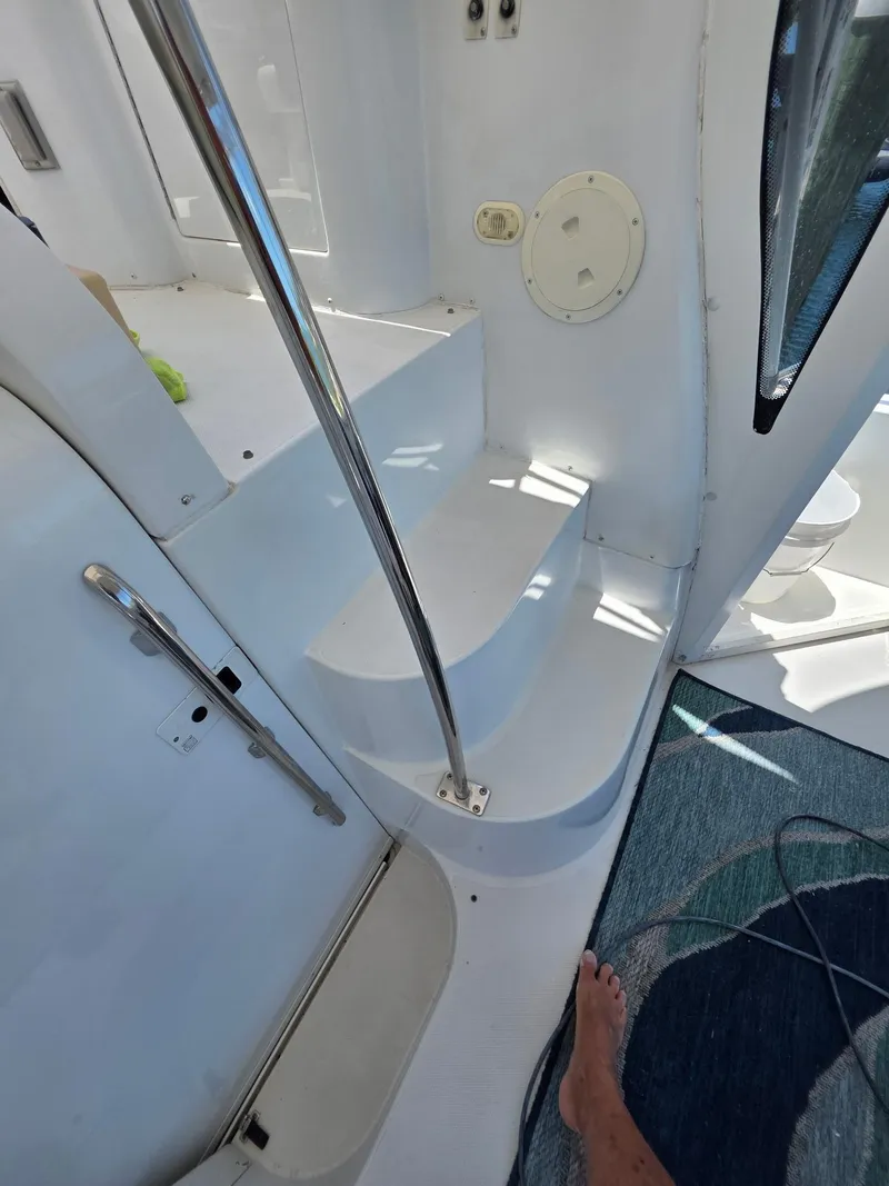 Slide: The Image of Interior stairs of a 2000 Carver 396 Motor Yacht with metal railing. - 27