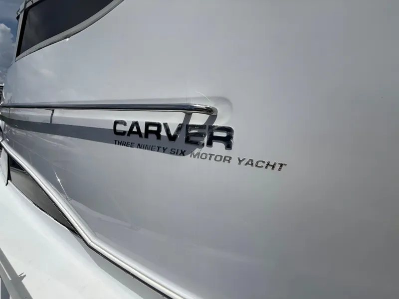 Slide: The Image of 2001 Carver 396 Motor Yacht side view with logo detail. - 29