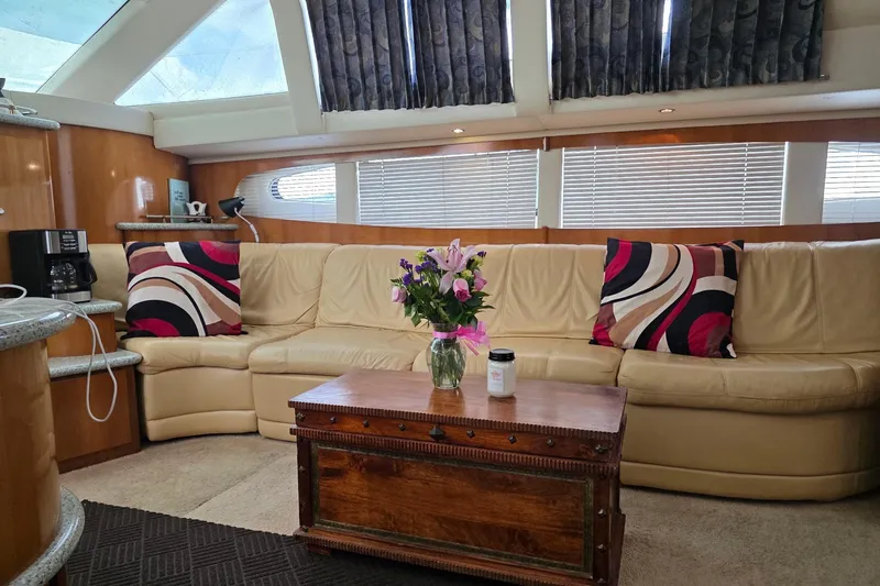 Slide: The Image of Luxurious interior of 2001 Carver 396 Motor Yacht with leather seating and decorative pillows. - 32