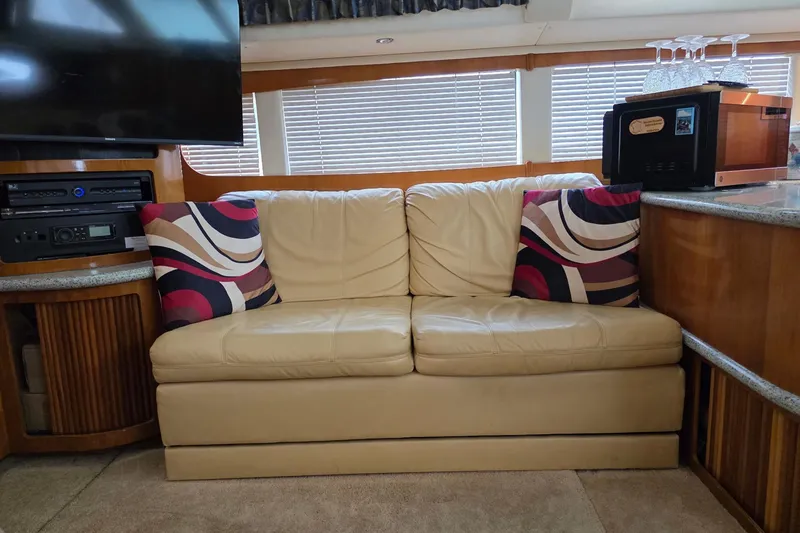 Slide: The Image of Luxurious interior of 2001 Carver 396 Motor Yacht with leather sofa and modern decor. - 34
