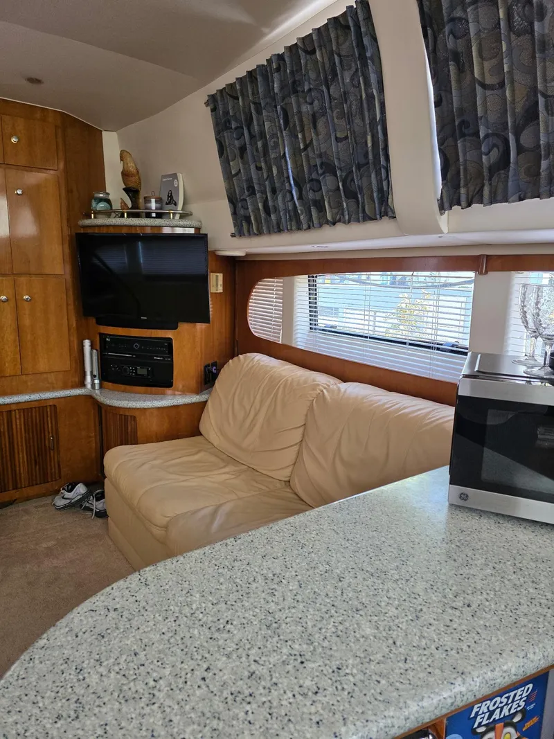 Slide: The Image of Interior of 2000 Carver 396 Motor Yacht with beige sofa and modern amenities. - 35