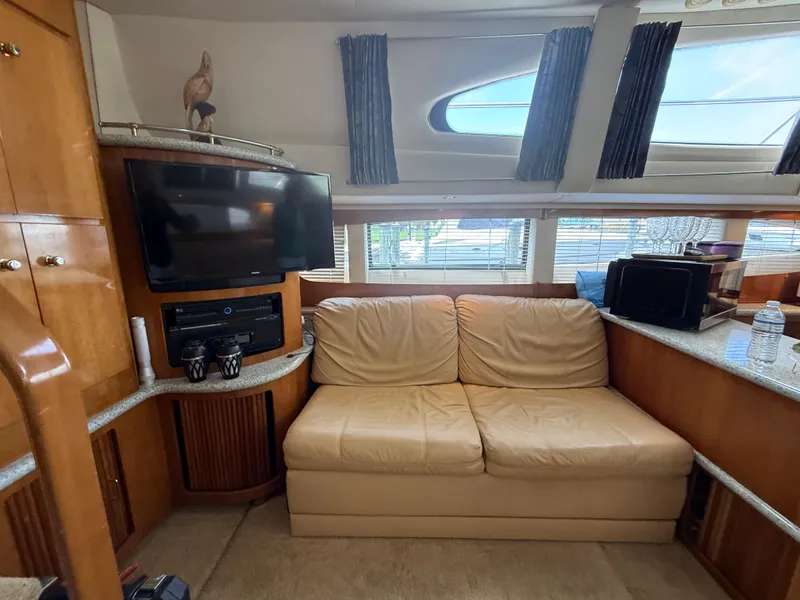 Slide: The Image of Luxurious interior of 2001 Carver 396 Motor Yacht with leather sofa and entertainment system. - 38
