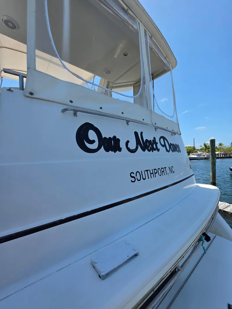 Slide: The Image of 2000 Carver 396 Motor Yacht docked in Southport, NC, with "Our Next Dream" name. - 4