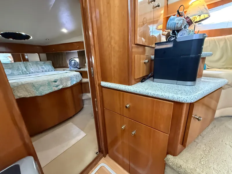 Slide: The Image of Interior of 2001 Carver 396 Motor Yacht with cozy bedroom and kitchenette area. - 40