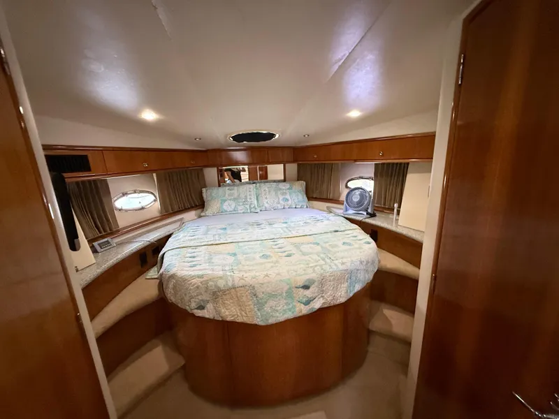 Slide: The Image of Luxurious bedroom in 2001 Carver 396 Motor Yacht with cozy bed and wooden cabinetry. - 41