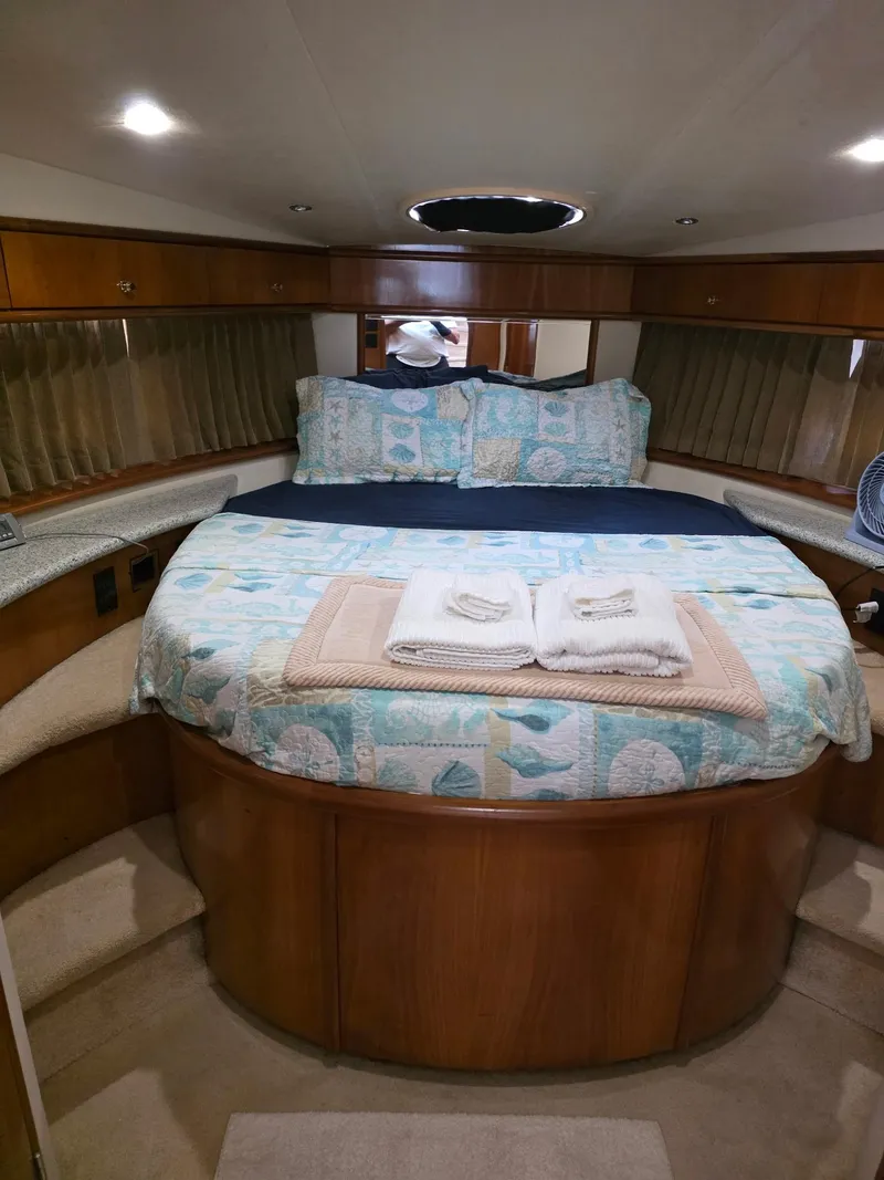 Slide: The Image of Interior of 2000 Carver 396 Motor Yacht with cozy bed and elegant wood finish. - 42