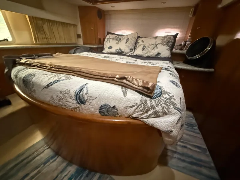 Slide: The Image of Luxurious bedroom interior of 2001 Carver 396 Motor Yacht with elegant bedding. - 45
