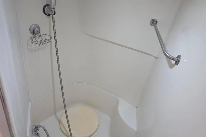Slide: The Image of Shower area in 2001 Carver 396 Motor Yacht with handheld showerhead and grab bar. - 48