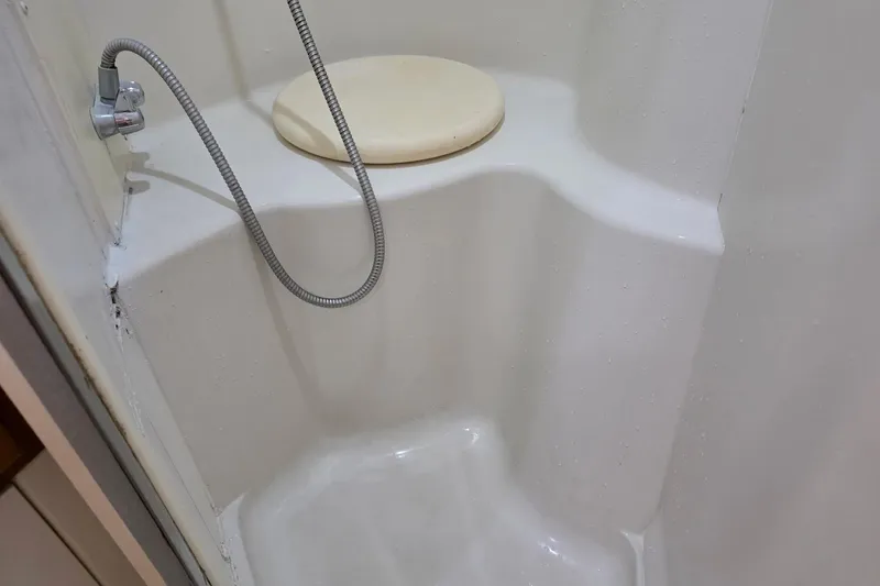 Slide: The Image of Shower area in 2001 Carver 396 Motor Yacht with handheld showerhead and seat. - 49