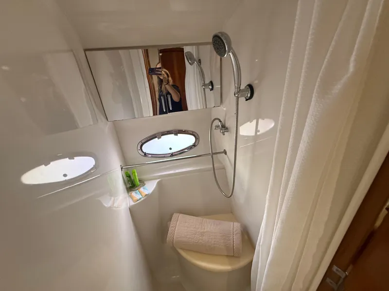 Slide: The Image of Bathroom interior of 2001 Carver 396 Motor Yacht with shower and porthole windows. - 52