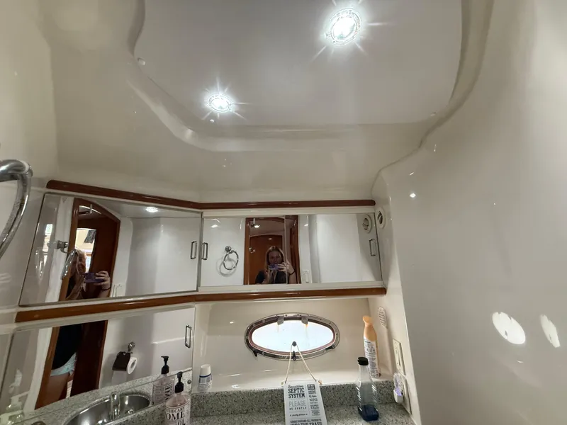 Slide: The Image of Interior of 2001 Carver 396 Motor Yacht bathroom with mirrors and lighting. - 55