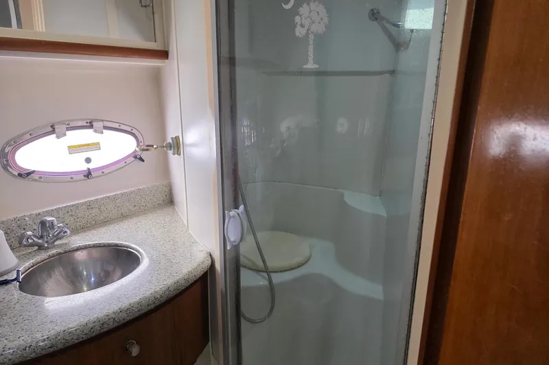 Slide: The Image of Bathroom interior of 2001 Carver 396 Motor Yacht with shower and sink. - 56