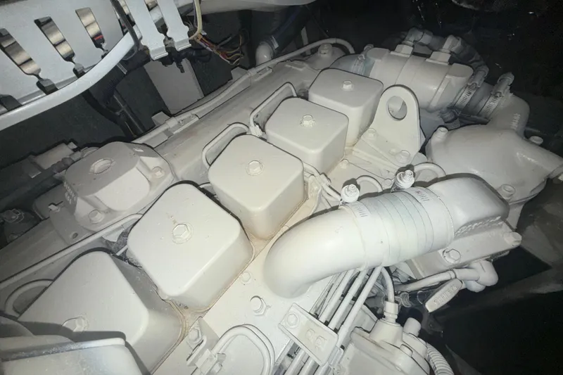 Slide: The Image of Engine compartment of a 2001 Carver 396 Motor Yacht, showcasing mechanical components. - 61