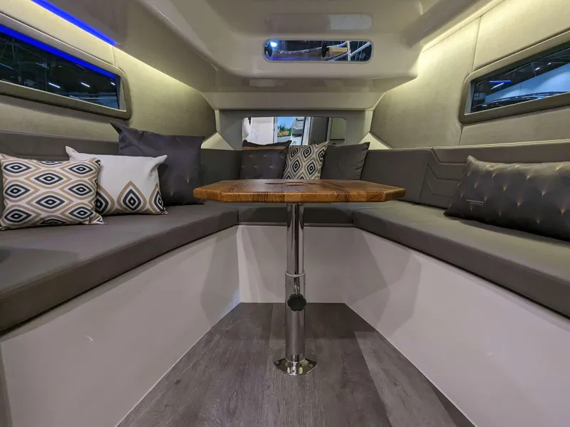 Slide: The Image of Interior of 2025 Hanover 347 Inboard boat with modern seating and wooden table. - 15