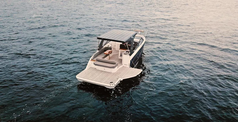 Slide: The Image of 2025 Hanover 347 Inboard boat cruising on open water, rear view. - 5