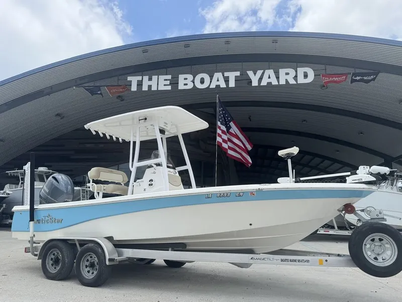 Slide: The Image of 2022 NauticStar 215 Bay boat with Yamaha engine on trailer. - 11