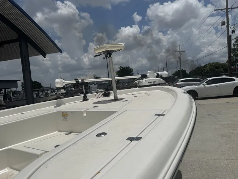 Slide: The Image of NauticStar 215 Bay 2022 with seating area and helm console. - 15