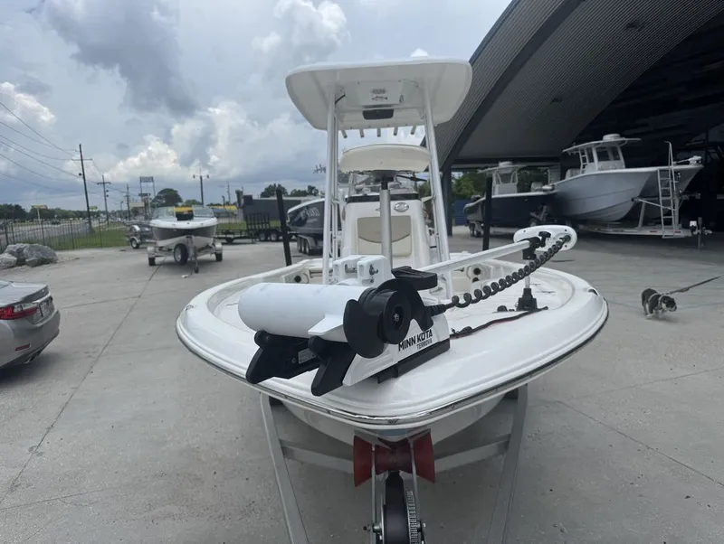 Slide: The Image of NauticStar 215 Bay 2022 boat on parking lot under cloudy sky. - 9