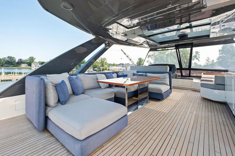 Slide: The Image of Luxurious 2018 Ferretti Yachts 780 interior with elegant seating and wooden flooring. - 13