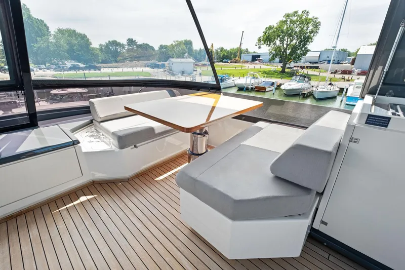 Slide: The Image of Luxurious seating area on 2018 Ferretti Yachts 780 with marina view. - 16