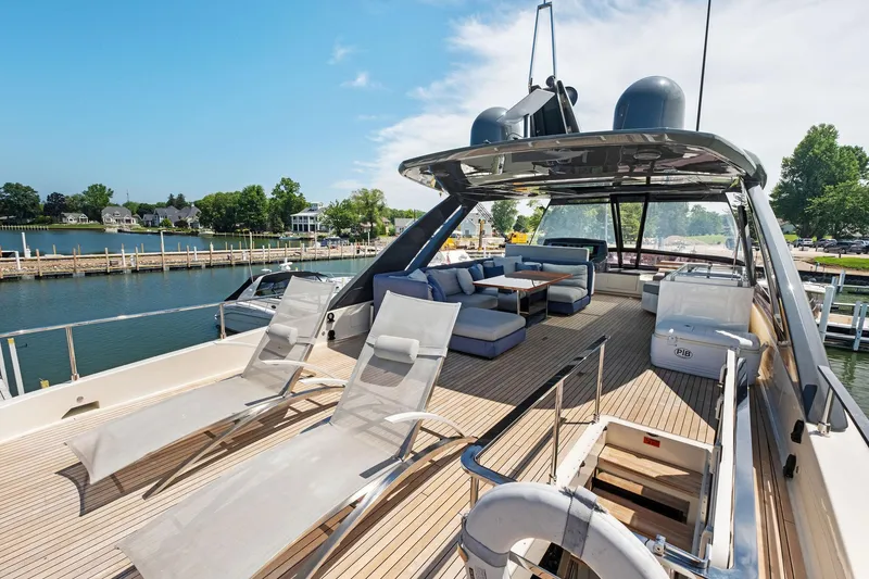 Slide: The Image of Luxurious 2018 Ferretti Yachts 780 with spacious deck, sun loungers, and elegant seating area. - 20