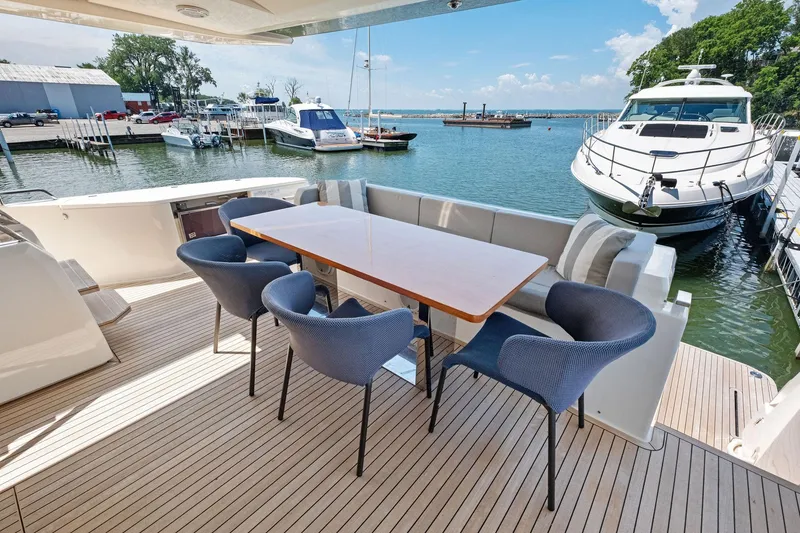 Slide: The Image of Outdoor dining area on 2018 Ferretti Yachts 780, featuring elegant seating and waterfront view. - 30