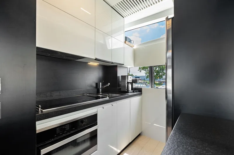 Slide: The Image of Modern kitchen interior on 2018 Ferretti Yachts 780, featuring sleek cabinetry and appliances. - 40