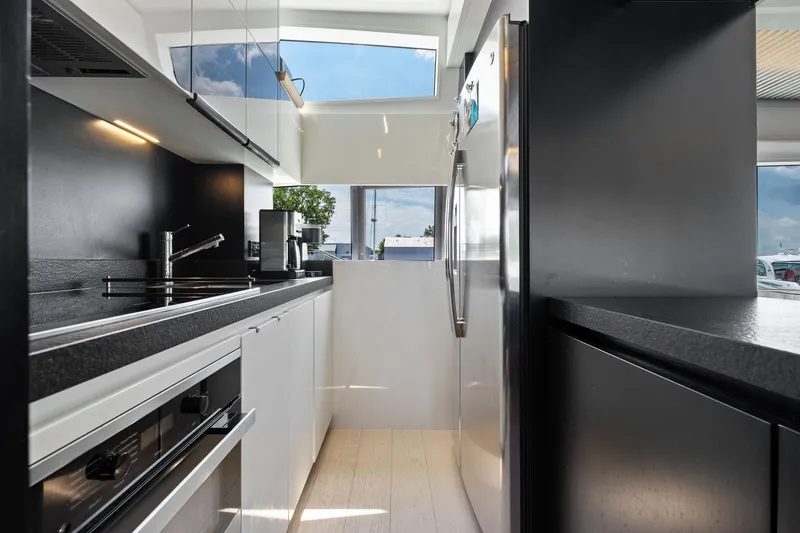 Slide: The Image of Modern kitchen interior on 2018 Ferretti Yachts 780, featuring sleek appliances and minimalist design. - 41